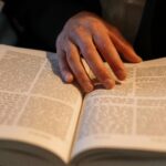 Donations Close-up of an Orthodox Jewish man reading a Hebrew Torah during Shabbat.